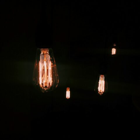3 light bulb turned on in dark room